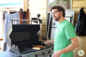 Kale at the BBQ cooking Tofurky Sausages