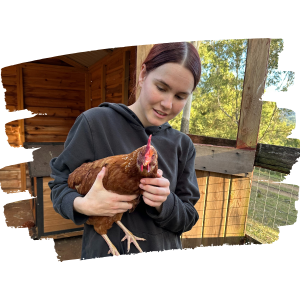 A sponsor holds her rescued chicken